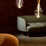 Elegant modern living room with designer lighting and minimalistic furniture.